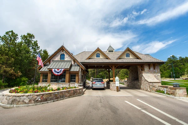 The stone entry gate and guardhouse at The Village Castle Pines